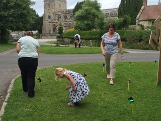 Planting windmills made by the school children for the windmill building competition